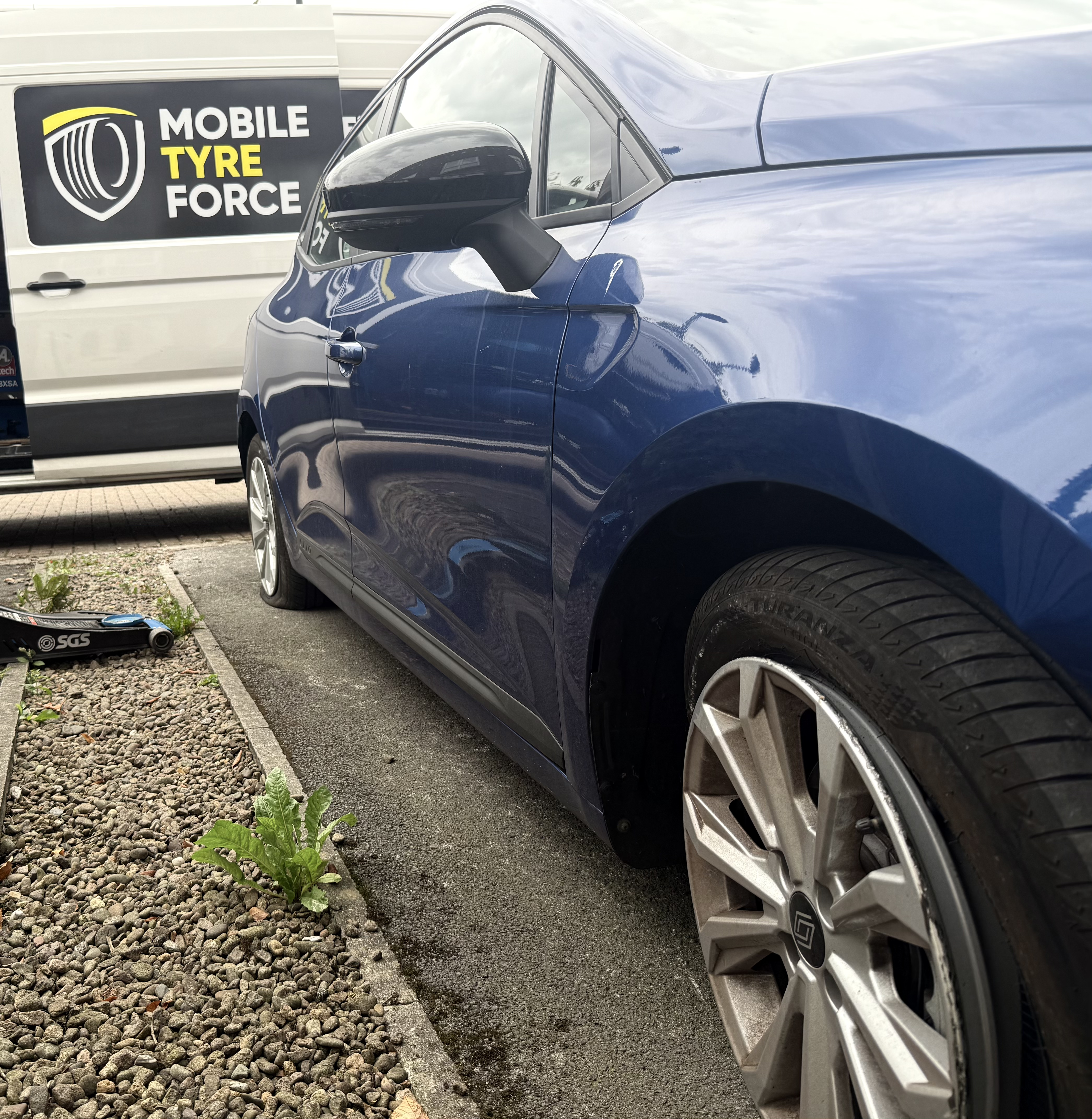 Mobile tyre fitting van attending a locking wheel nut removal